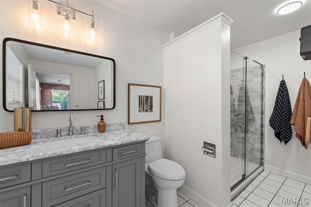 1 Woodoaks Trl, Saint Louis, MO 63124 - bathroom with vanity, a stall shower, tile patterned floors, toilet, and baseboards