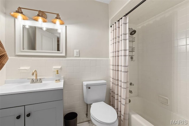 1 Woodoaks Trl, Saint Louis, MO 63124 - bathroom with vanity, shower / bath combo, toilet, tile walls, and wainscoting