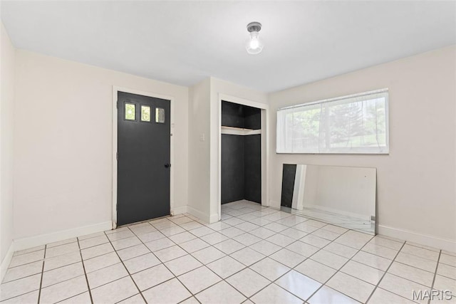 1 Woodoaks Trl, Saint Louis, MO 63124 - entryway featuring plenty of natural light, light tile patterned floors, and baseboards