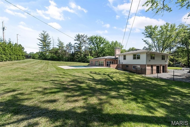 1 Woodoaks Trl, Saint Louis, MO 63124 - view of yard featuring an attached garage and a patio area