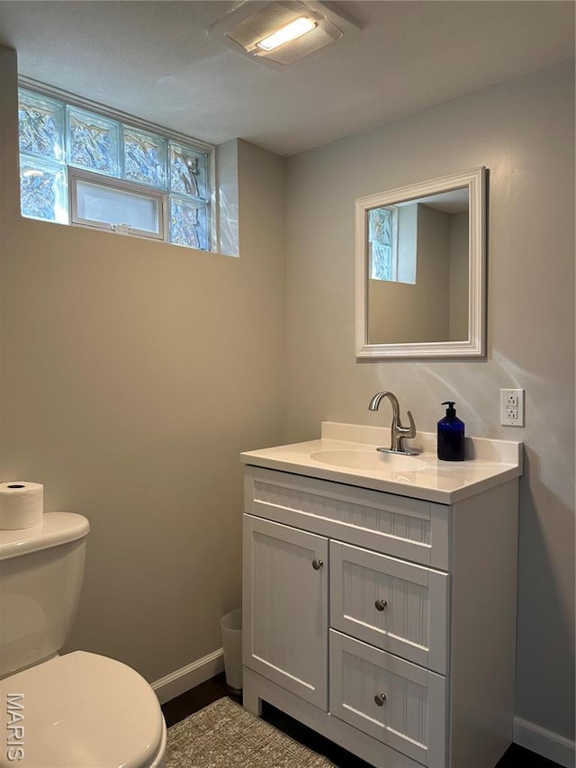 3985 Lakeshore Dr, New Haven, MO 63068 - half bath with toilet, vanity, and baseboards