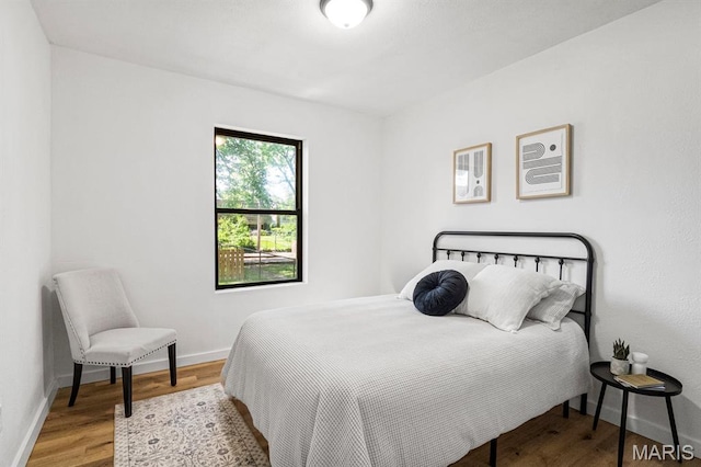 3641 Virginia Ave, Saint Louis, MO 63118 - bedroom featuring wood finished floors and baseboards