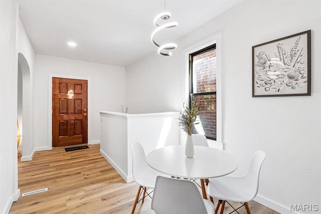 3641 Virginia Ave, Saint Louis, MO 63118 - dining room featuring light wood-type flooring and baseboards