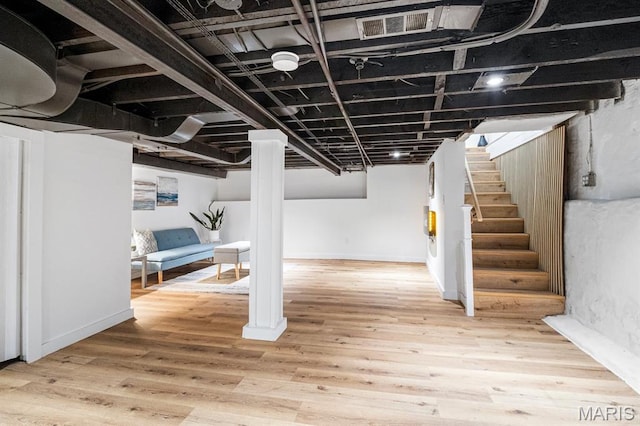 3641 Virginia Ave, Saint Louis, MO 63118 - finished below grade area with stairs, wood finished floors, and baseboards