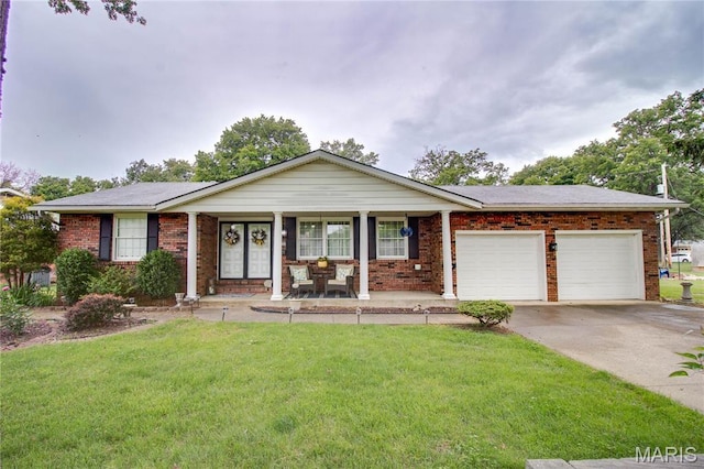 2332 Chadwick Dr, Alton, IL 62002 - single story home with a front yard, covered porch, a garage, driveway, and brick siding