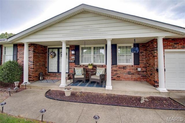 2332 Chadwick Dr, Alton, IL 62002 - view of front facade featuring covered porch and brick siding