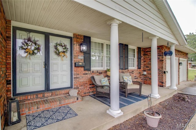 2332 Chadwick Dr, Alton, IL 62002 - doorway to property with covered porch and brick siding