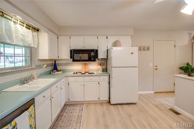2332 Chadwick Dr, Alton, IL 62002 - kitchen featuring white appliances, a sink, light wood-style floors, and white cabinetry