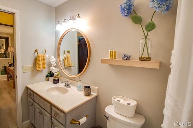 2332 Chadwick Dr, Alton, IL 62002 - bathroom featuring toilet, vanity, and wood finished floors