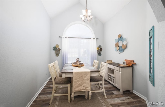 dining area featuring dark wood-type flooring, lofted ceiling, a chandelier, and baseboards