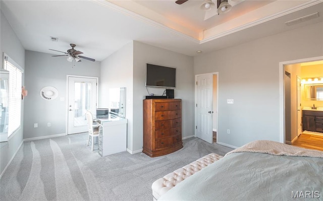 carpeted bedroom featuring baseboards, a ceiling fan, and ensuite bath