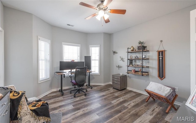office featuring wood finished floors, plenty of natural light, ceiling fan, and baseboards