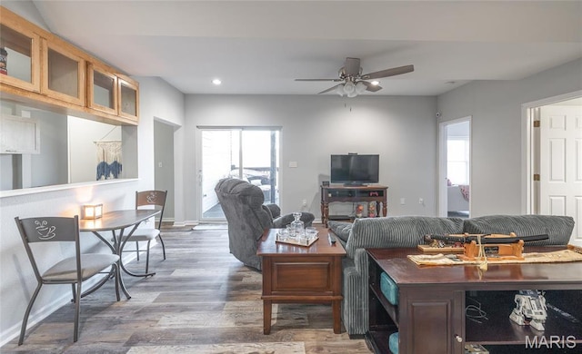 living area with healthy amount of natural light, wood finished floors, recessed lighting, and ceiling fan