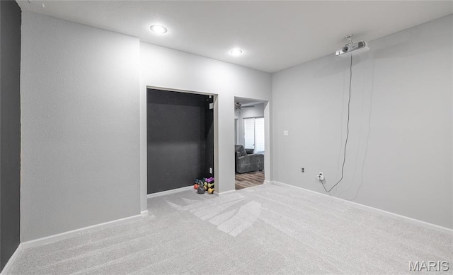 unfurnished bedroom with carpet, baseboards, and recessed lighting