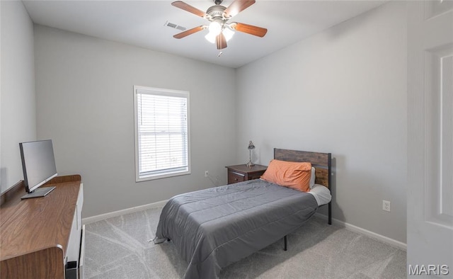 carpeted bedroom with baseboards and ceiling fan