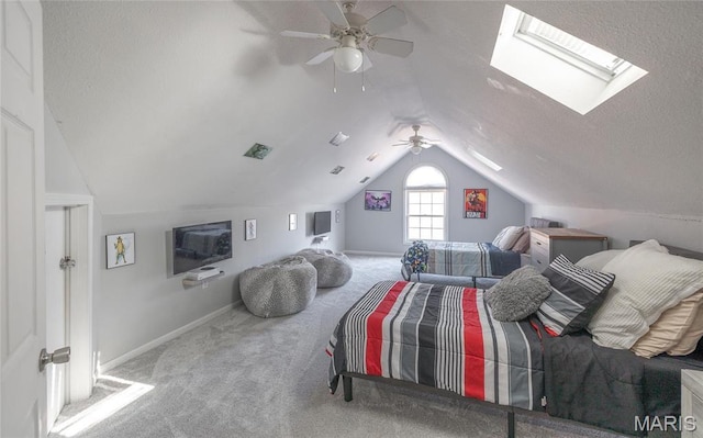 bedroom with carpet flooring, vaulted ceiling, a ceiling fan, and baseboards