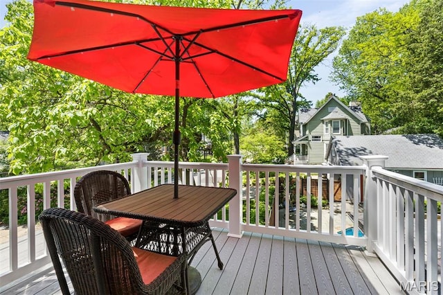 wooden deck featuring outdoor dining space