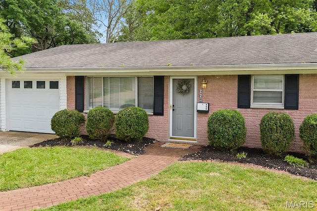 22 Briarwood Dr, Belleville, IL 62223 - ranch-style house featuring a garage, brick siding, roof with shingles, and a front lawn