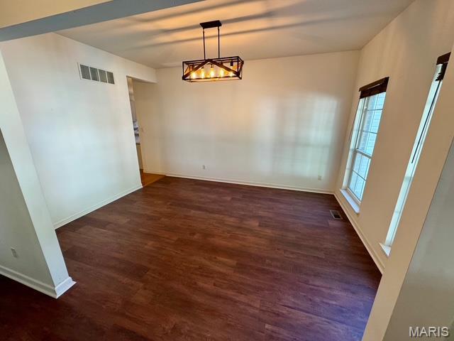 650 Legends View Dr, Eureka, MO 63025 - unfurnished dining area with wood finished floors, baseboards, and a chandelier