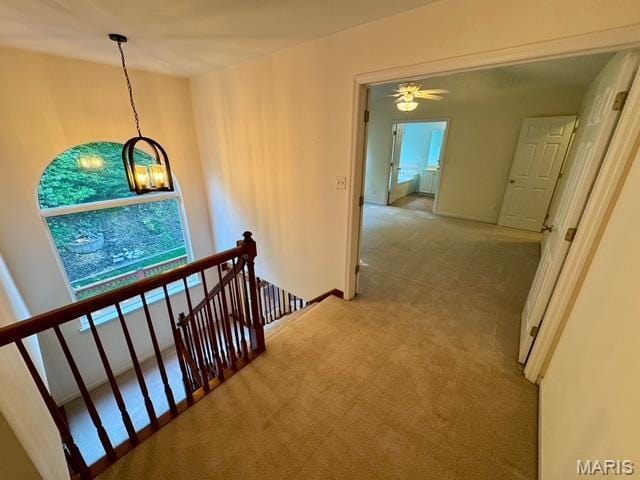 650 Legends View Dr, Eureka, MO 63025 - hallway featuring an upstairs landing, carpet flooring, and baseboards