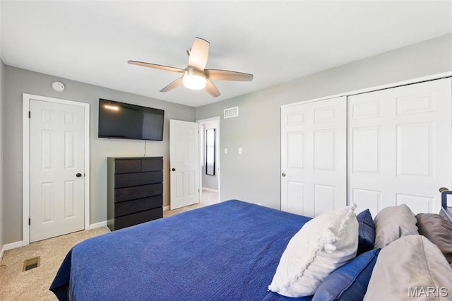 carpeted bedroom featuring baseboards, a ceiling fan, and a closet