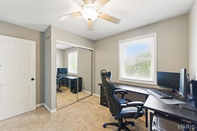 office with light colored carpet, baseboards, and ceiling fan