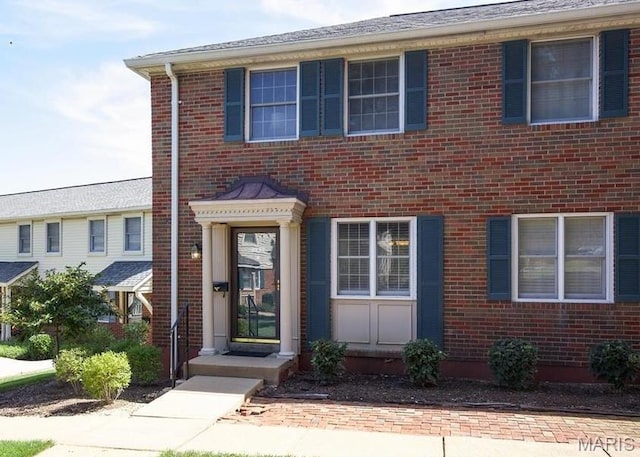 view of front of house with brick siding