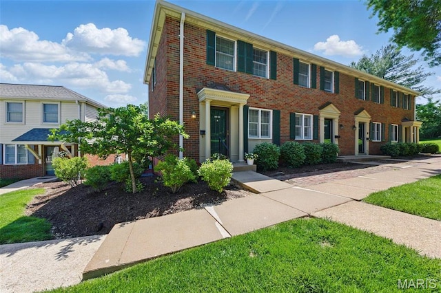 view of front of home featuring brick siding