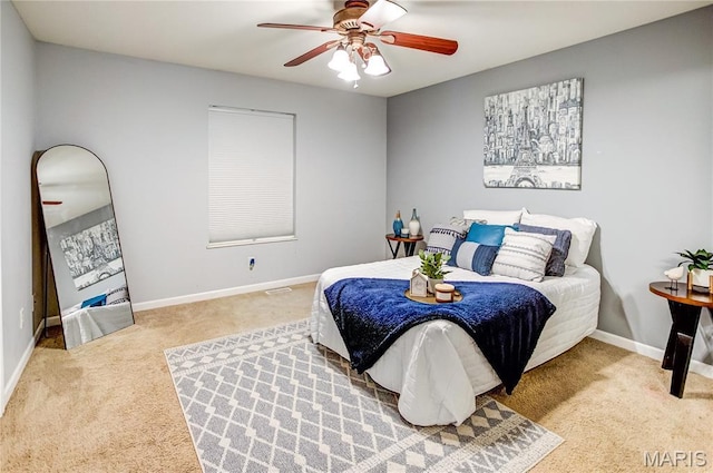 bedroom featuring carpet floors, a ceiling fan, and baseboards