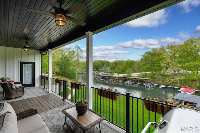 10028 Pineridge Dr, Effingham, IL 62401 - wooden deck with a water view, a ceiling fan, a lawn, and view of wooded area