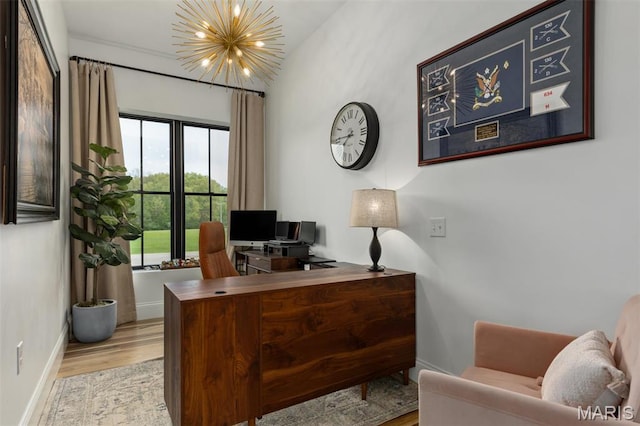10028 Pineridge Dr, Effingham, IL 62401 - office area featuring a chandelier, wood finished floors, and baseboards