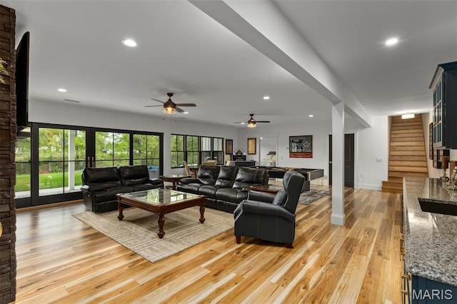 10028 Pineridge Dr, Effingham, IL 62401 - living room with light wood-type flooring, stairs, ceiling fan, and recessed lighting