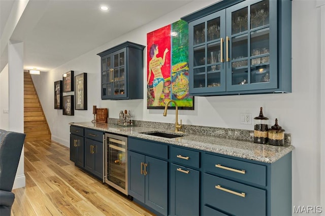 10028 Pineridge Dr, Effingham, IL 62401 - indoor wet bar featuring beverage cooler, light wood-style floors, stairs, recessed lighting, and baseboards