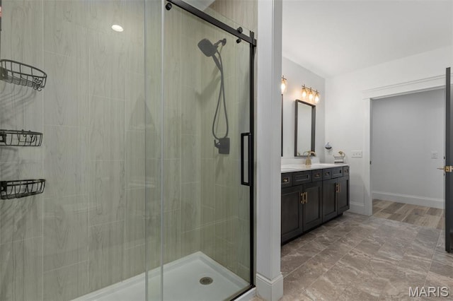 10028 Pineridge Dr, Effingham, IL 62401 - full bathroom with vanity, a shower stall, and baseboards