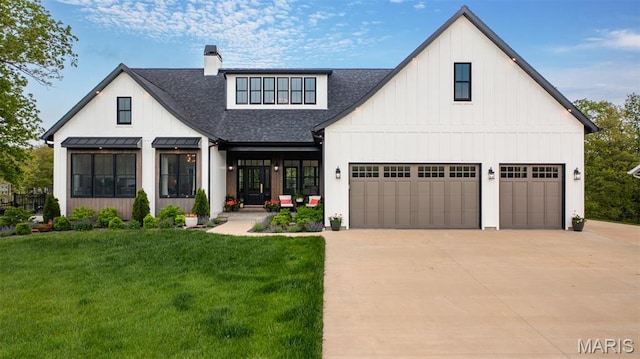 10028 Pineridge Dr, Effingham, IL 62401 - view of front of house with a shingled roof, concrete driveway, a front yard, and a standing seam roof