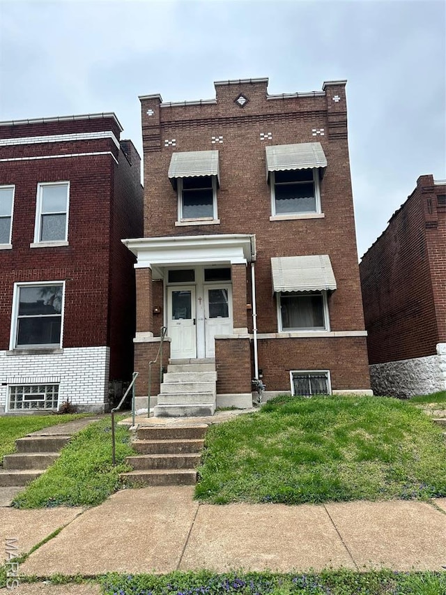 3636 Arkansas Ave, Saint Louis, MO 63118 - view of front facade featuring brick siding