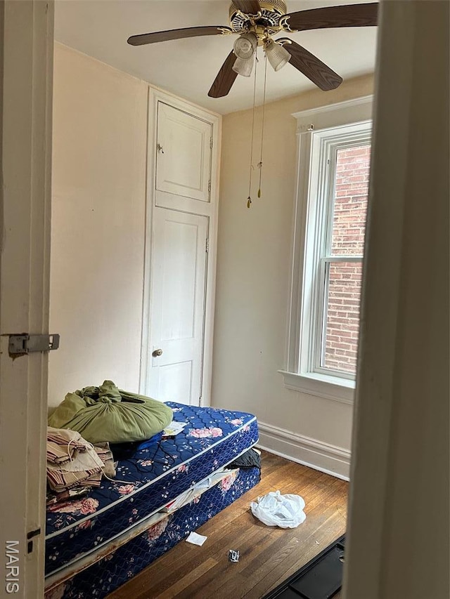 3636 Arkansas Ave, Saint Louis, MO 63118 - bedroom with wood finished floors, baseboards, and a ceiling fan