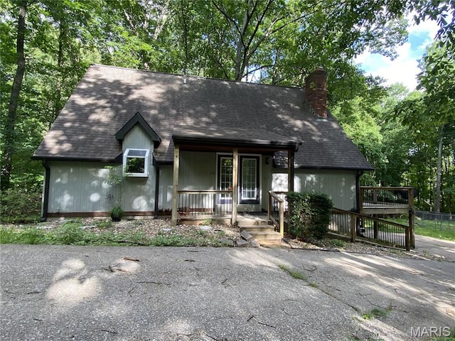 236 Mohawk Dr, Cape Girardeau, MO 63701 - view of front facade featuring covered porch and a chimney