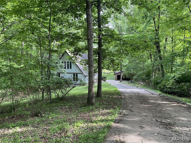 236 Mohawk Dr, Cape Girardeau, MO 63701 - view of asphalt driveway with a view of trees