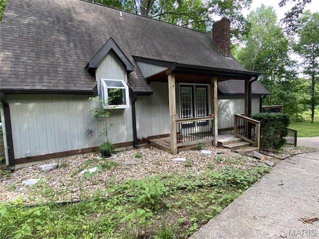 236 Mohawk Dr, Cape Girardeau, MO 63701 - view of front of property featuring a chimney, roof with shingles, and covered porch