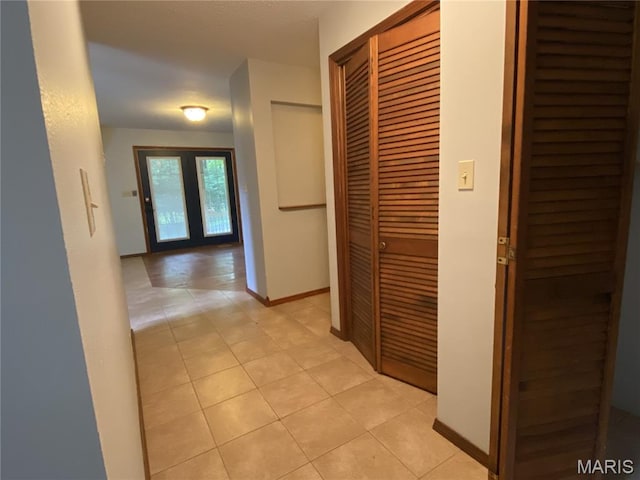 236 Mohawk Dr, Cape Girardeau, MO 63701 - corridor featuring light tile patterned flooring and baseboards