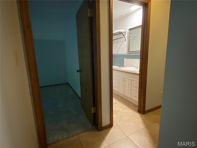 236 Mohawk Dr, Cape Girardeau, MO 63701 - corridor with light tile patterned floors, a sink, and baseboards
