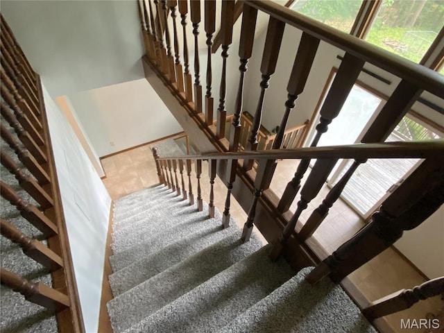 236 Mohawk Dr, Cape Girardeau, MO 63701 - staircase with plenty of natural light and tile patterned flooring