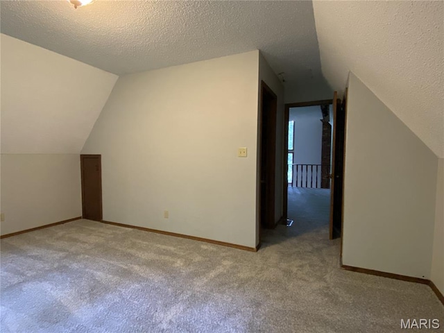236 Mohawk Dr, Cape Girardeau, MO 63701 - bonus room featuring lofted ceiling, carpet floors, baseboards, and a textured ceiling