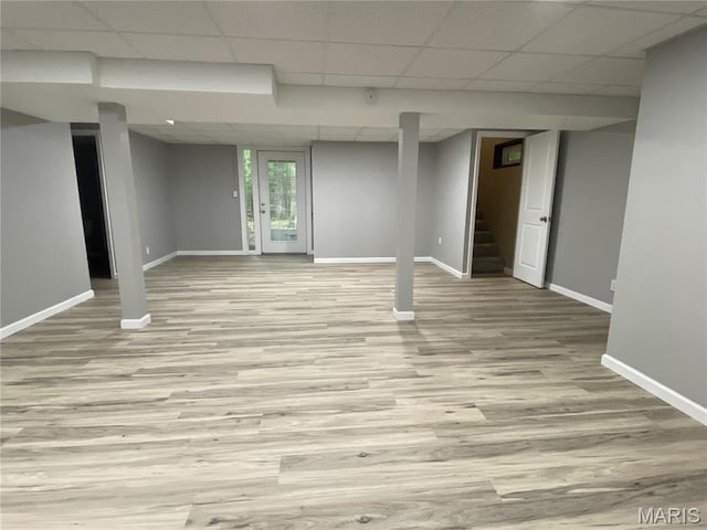 236 Mohawk Dr, Cape Girardeau, MO 63701 - basement featuring baseboards, a paneled ceiling, stairway, and wood finished floors