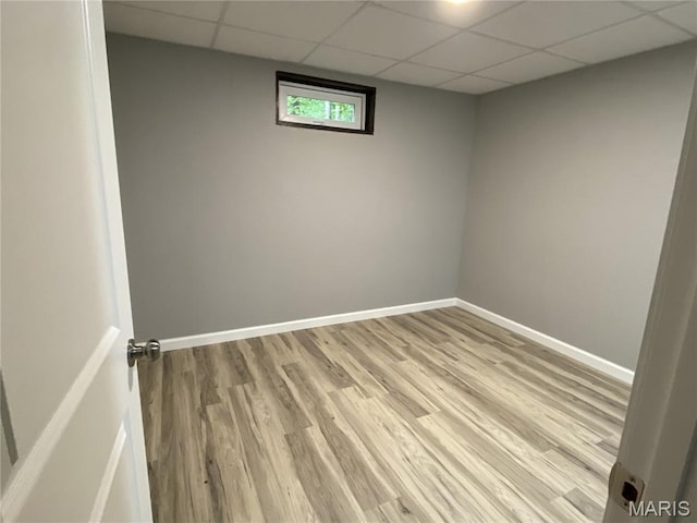 236 Mohawk Dr, Cape Girardeau, MO 63701 - unfurnished room with a paneled ceiling, light wood-type flooring, and baseboards