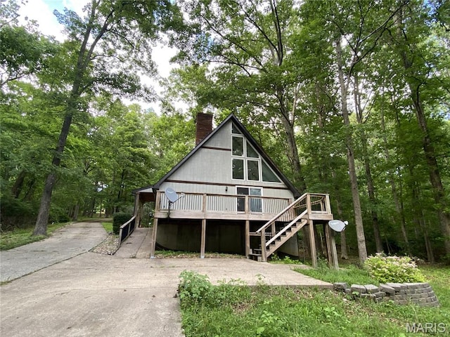 236 Mohawk Dr, Cape Girardeau, MO 63701 - view of front of property featuring a deck, a chimney, stairs, and concrete driveway