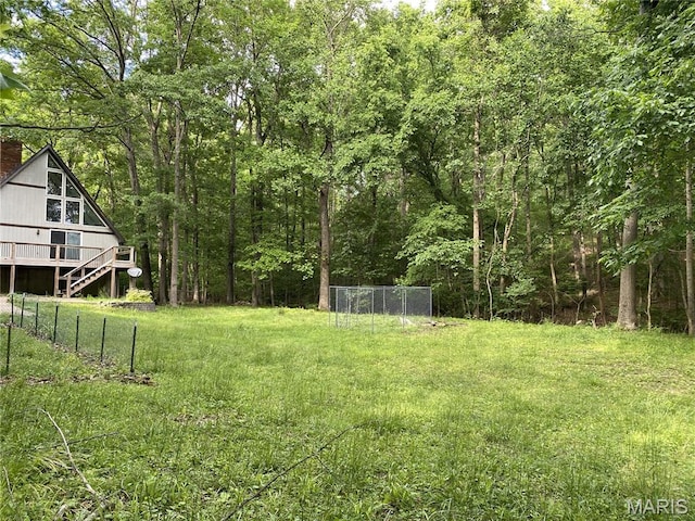 236 Mohawk Dr, Cape Girardeau, MO 63701 - view of yard with a wooden deck, stairs, and a forest view