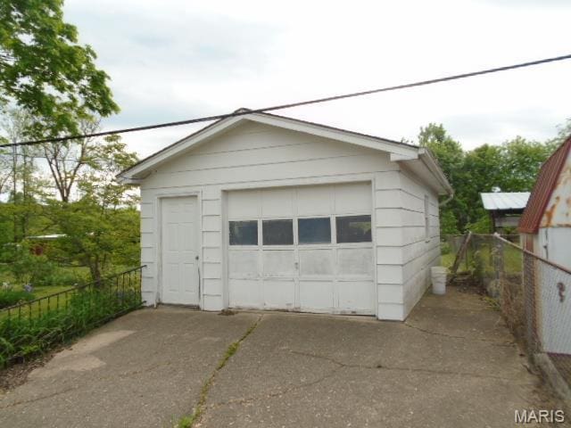 12 Tabitha Ln, Annapolis, MO 63620 - detached garage featuring concrete driveway and fence