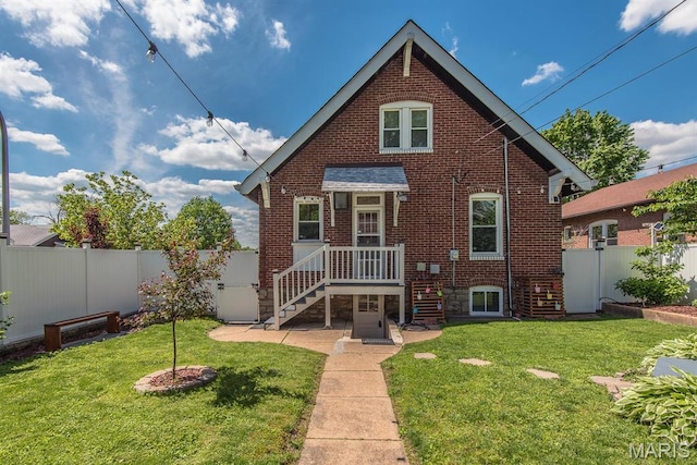 rear view of property with brick siding